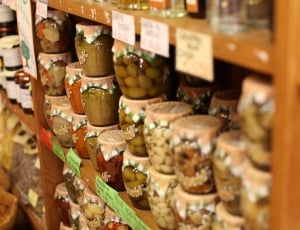 jars with nuts on rack on shallow photography thumbnail