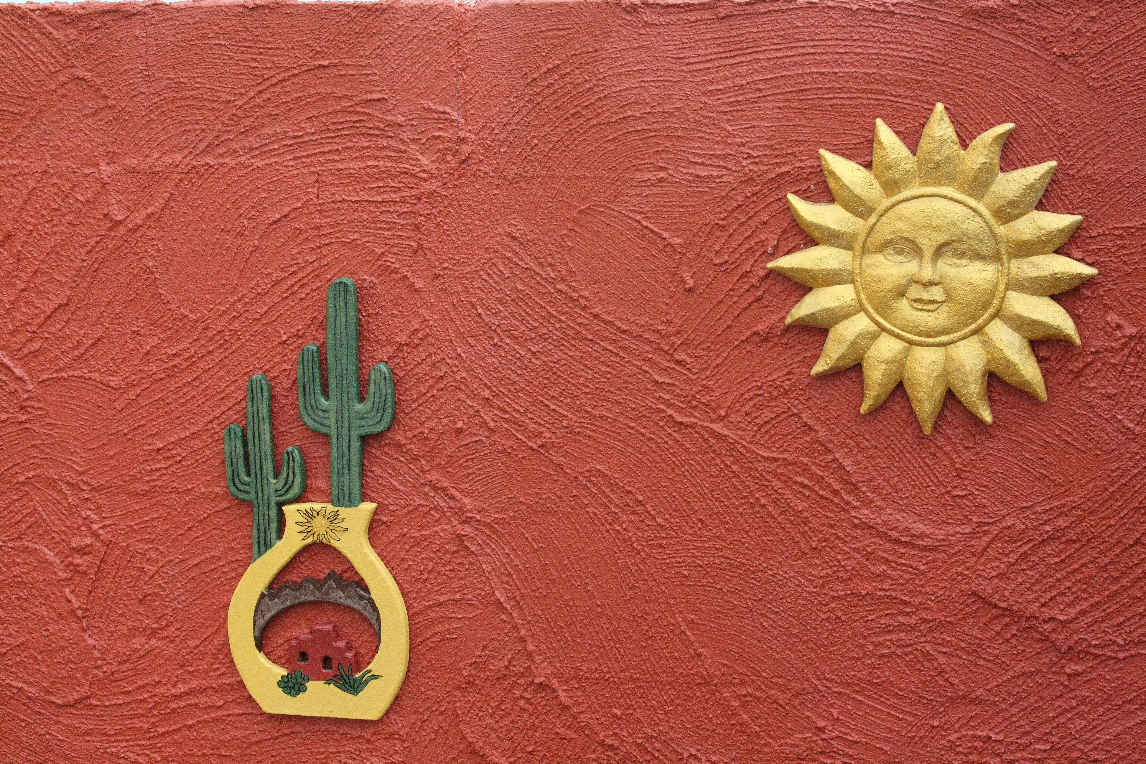 green and yellow cactus and sun wall decor