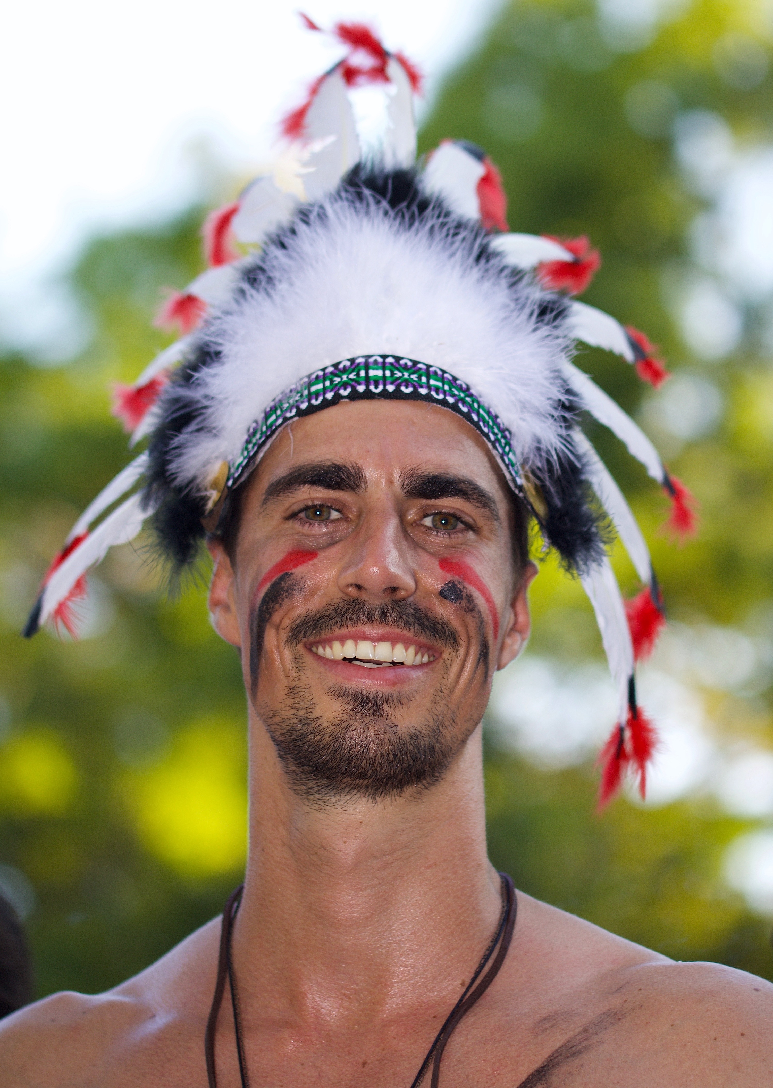 men's white red and black feather head dress