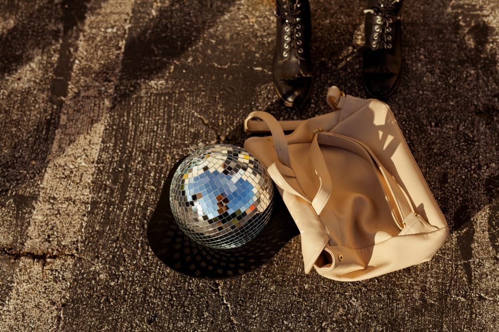 women's white leather shoulder bag and disco ball preview