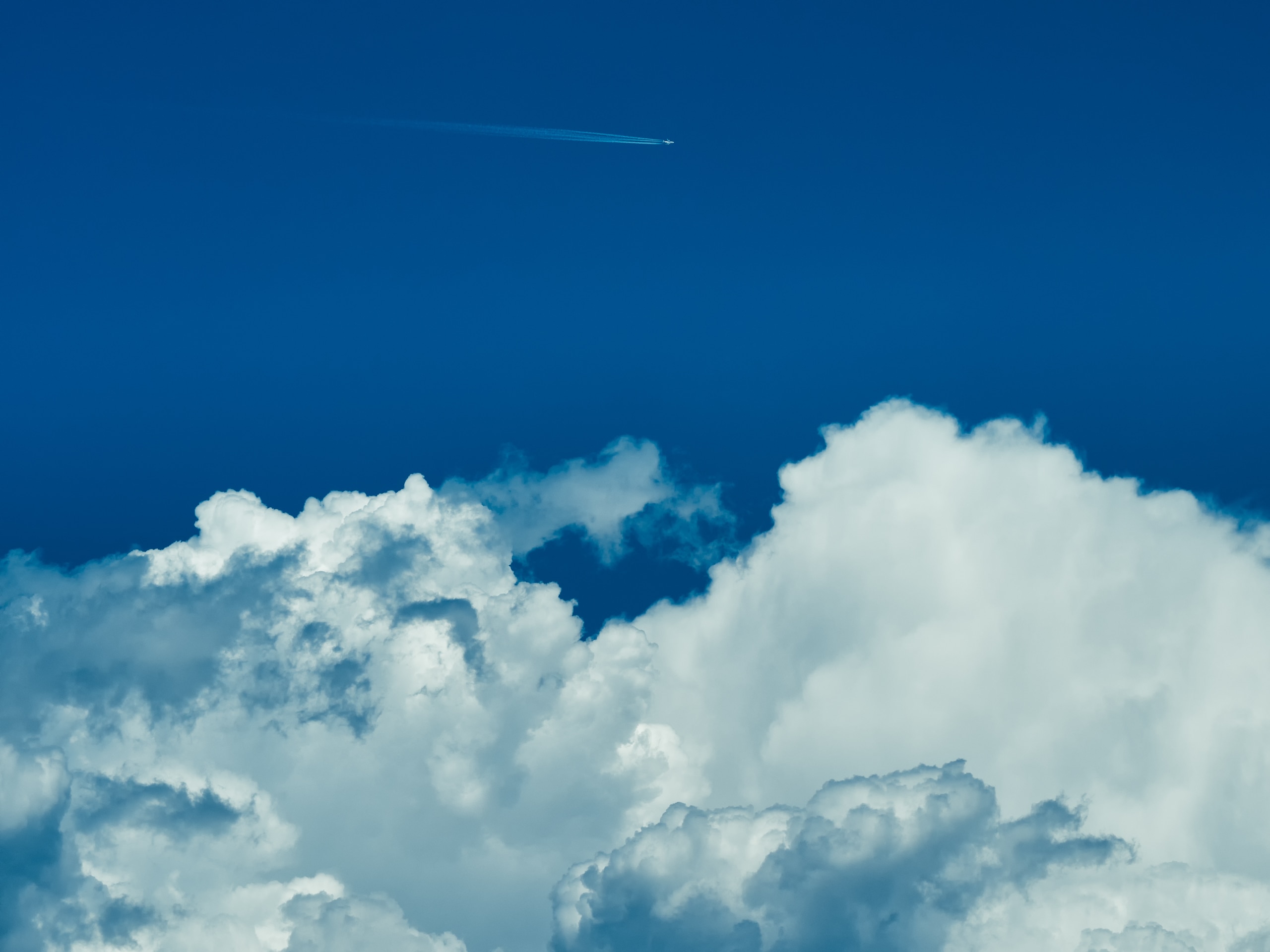 aeroplane over the white cloud