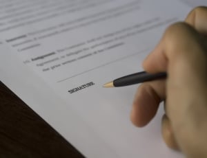 person signing a document thumbnail