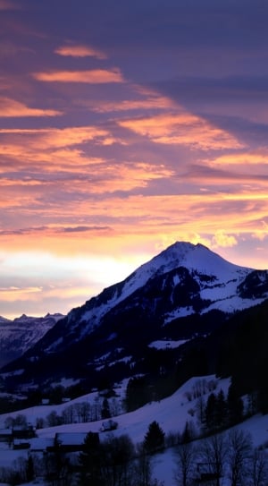 snowy mountains under red clouds thumbnail