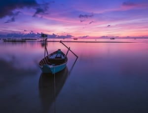 white boat on body of water thumbnail