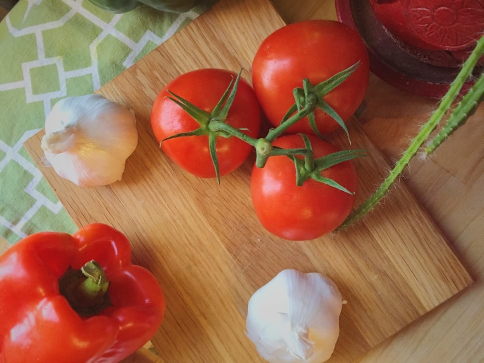 three red tomatoes and white garlic preview