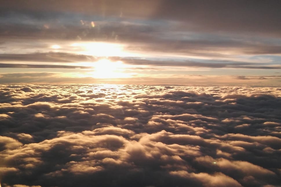 bird's eye view of clouds over seeing sun set preview