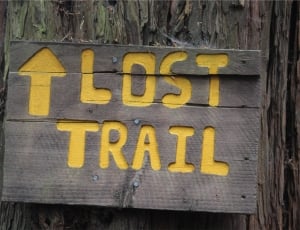 gray and yellow trail wooden signage thumbnail