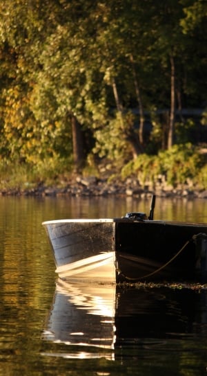 black wooden rowboat thumbnail