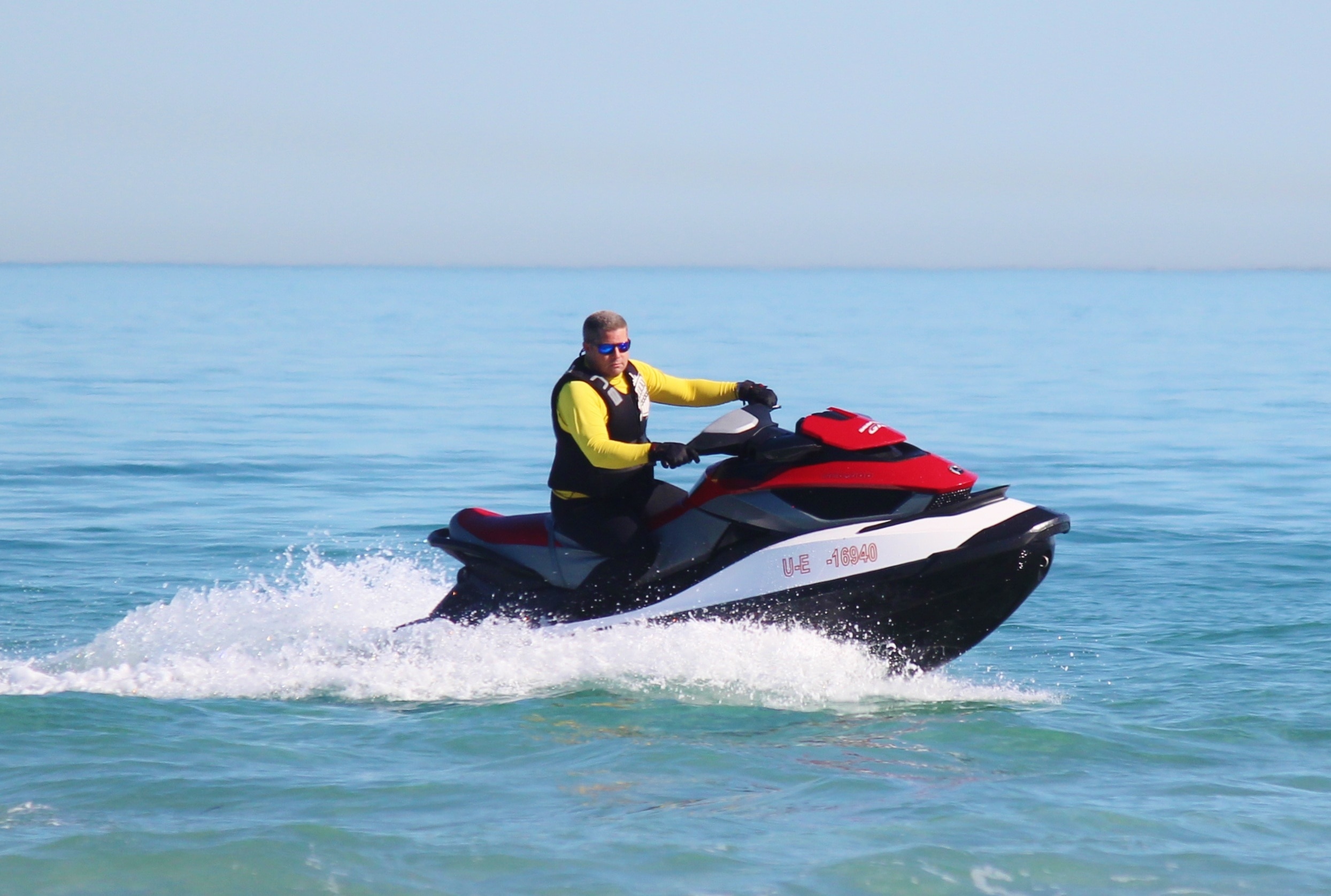 red black and white personal watercraft