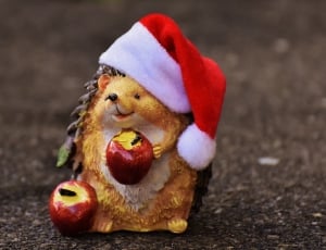 hedgehog with santa hat figurine thumbnail