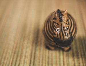 brown and black animal wooden table decor thumbnail