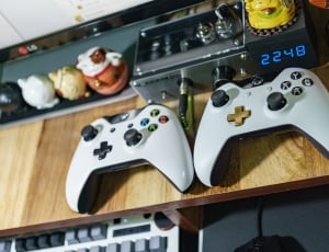 two xbox one wireless controller on table thumbnail