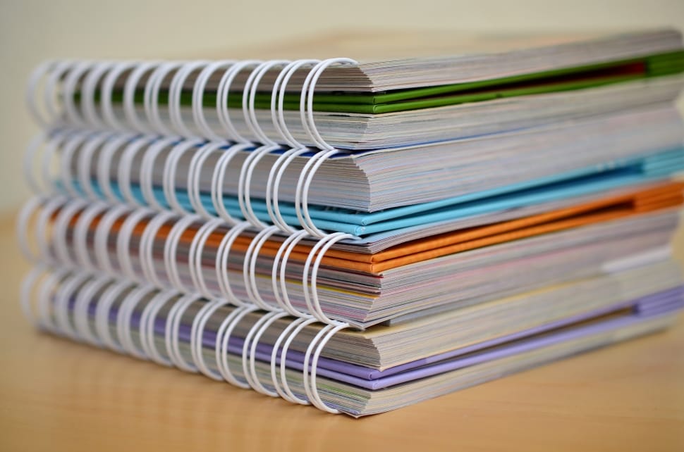 close up photo of four spiral notebooks preview