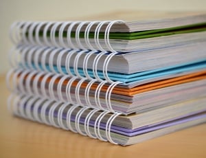 close up photo of four spiral notebooks thumbnail