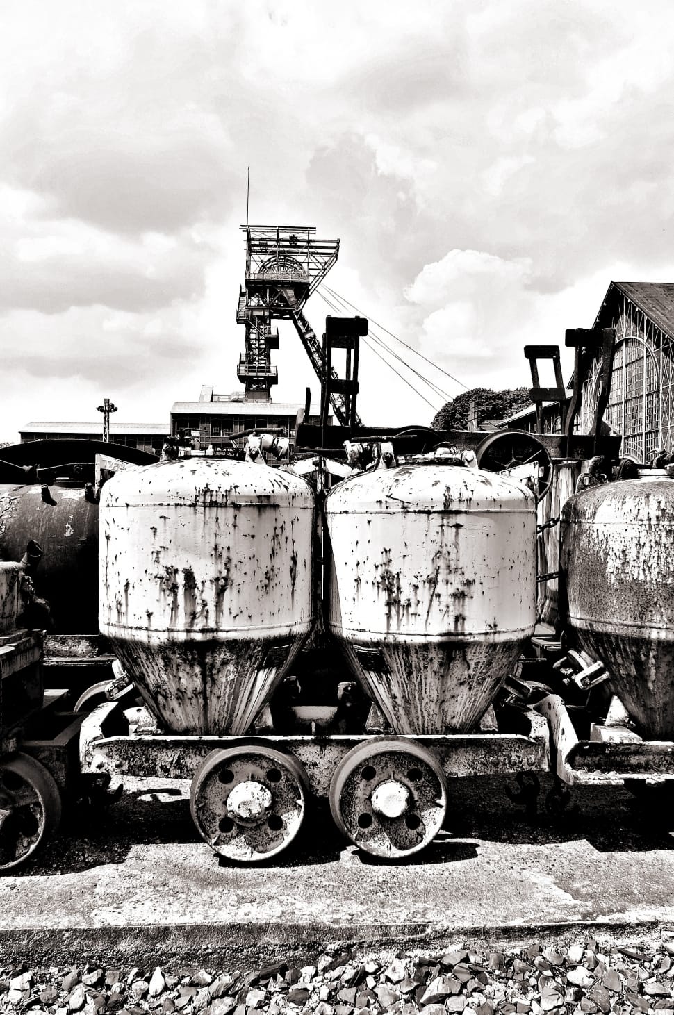grayscale photo of tanks with wheels preview
