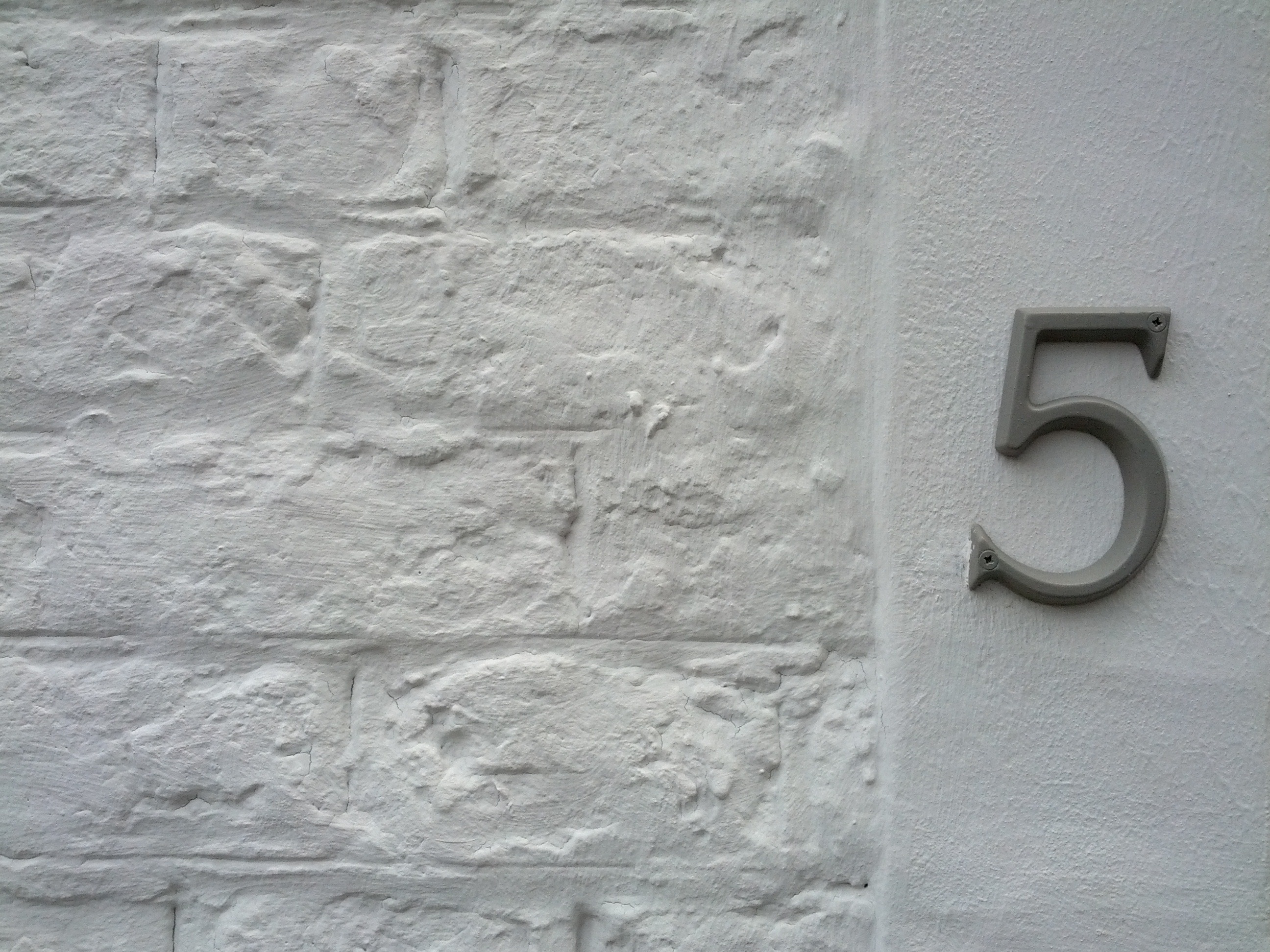 gray number house 5 signage