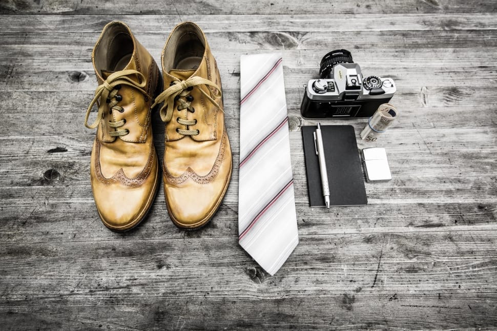 brown leather dress shoes necktie and camera preview