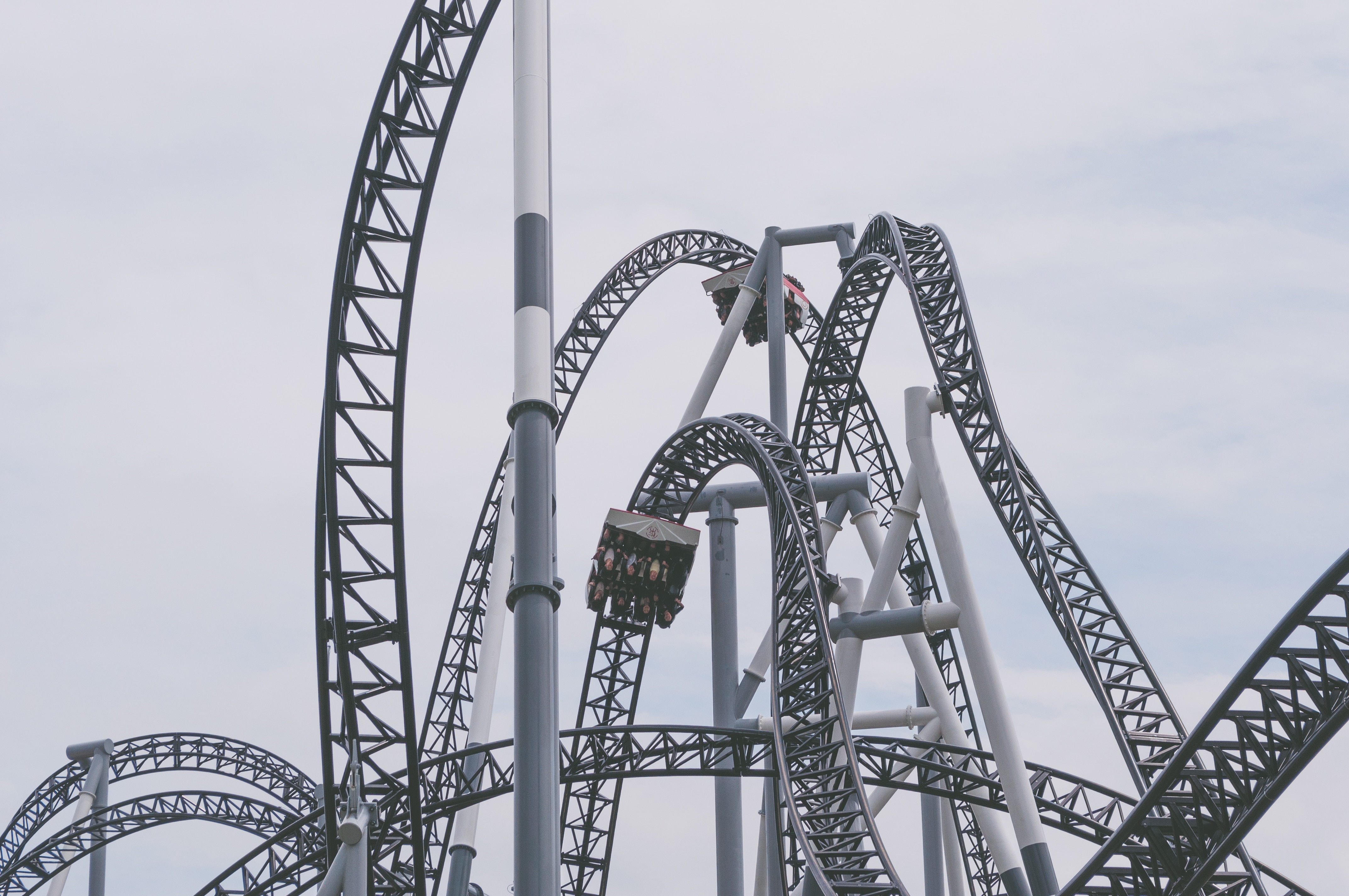 gray roller coasters under gray sky
