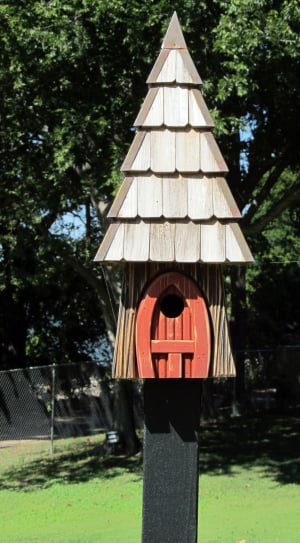 gray and orange wooden bird house thumbnail