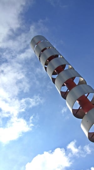 stainless and red tower under the blue skies thumbnail