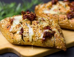 Sliced bread with white cream and red herbs thumbnail