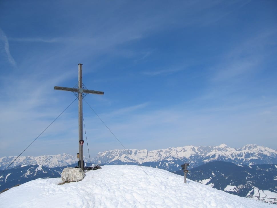 landscape photograph of snow mountain and gothic cross preview
