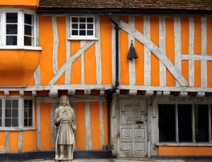 white and orange wooden 2 storey building thumbnail