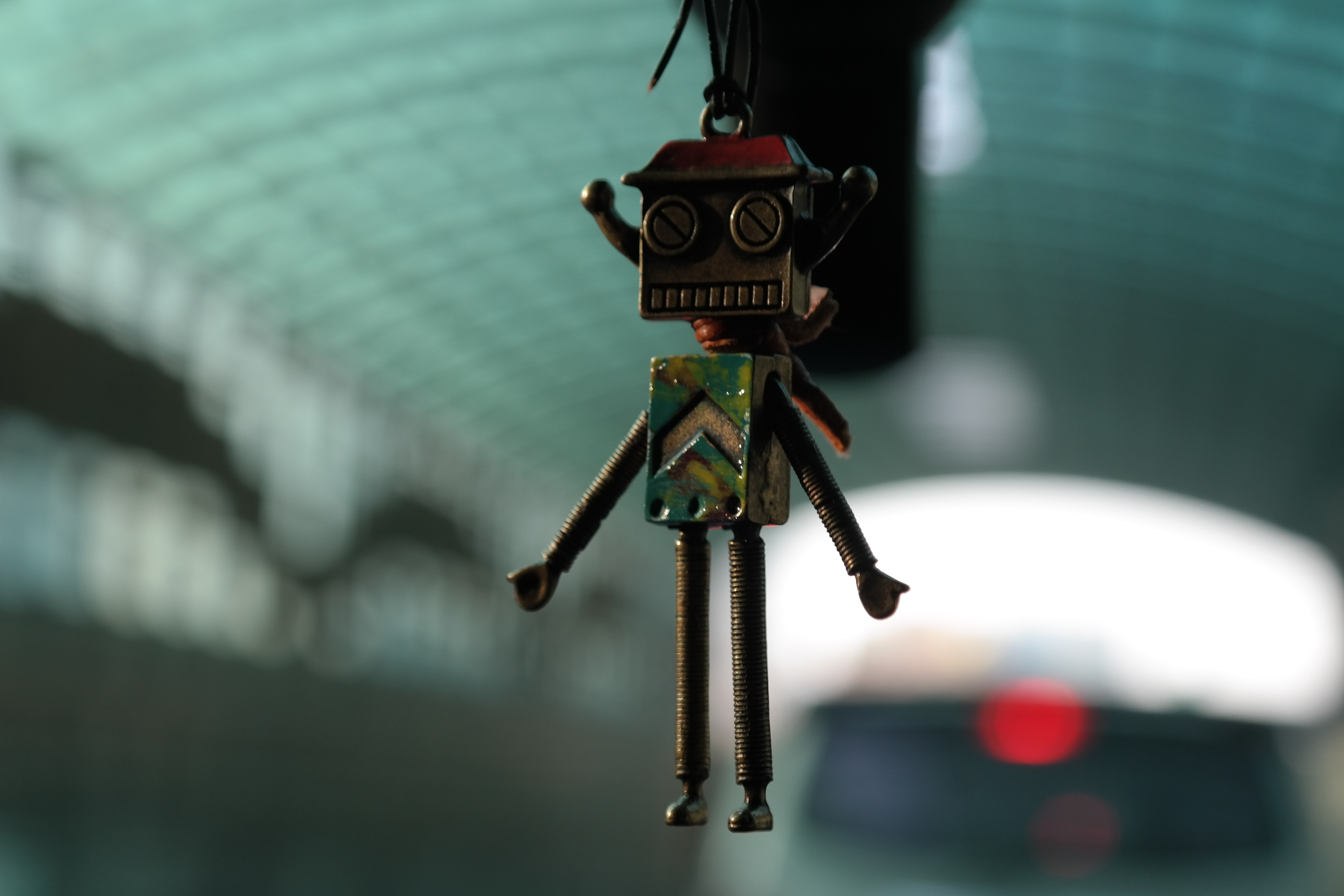 brown and green robot keychain