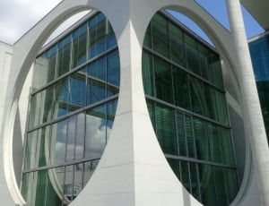 white and green glass concrete building thumbnail
