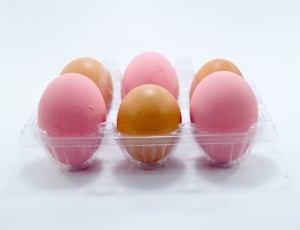 6 brown and pink eggs on plastic container thumbnail