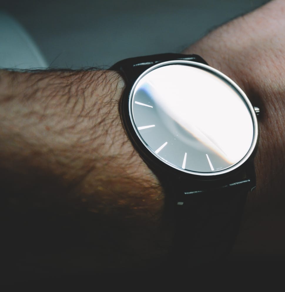 black round analog watch preview