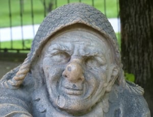 woman with critter hat concrete statuette thumbnail