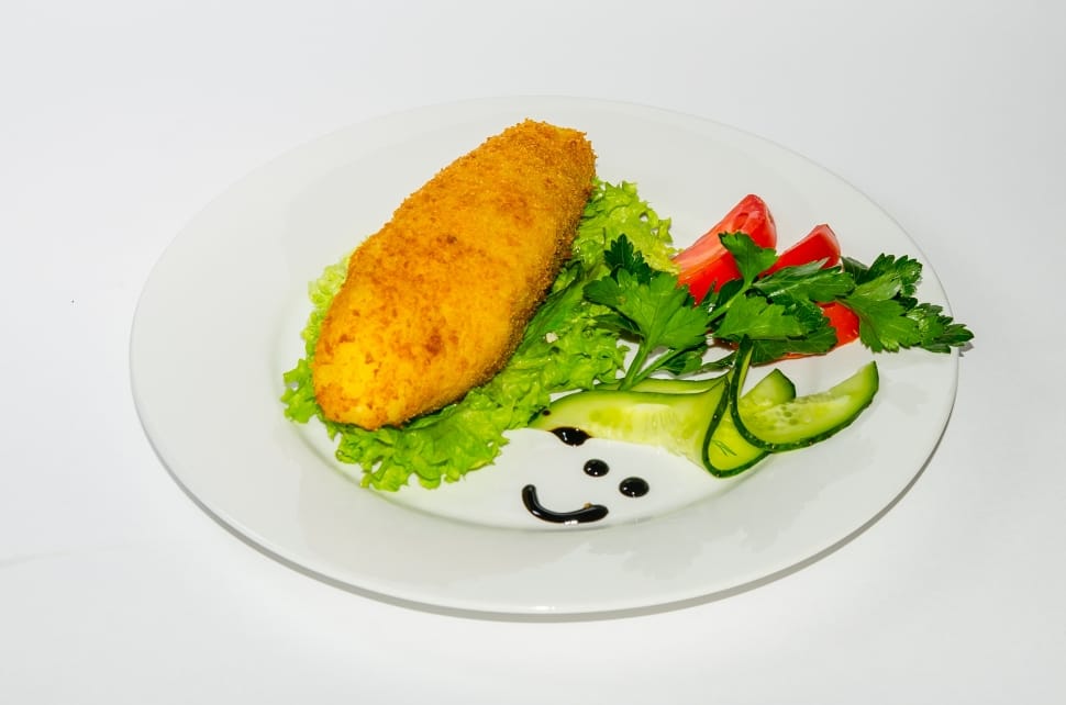 white ceramic plate serve with variety of vegetable with fried food preview