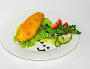 white ceramic plate serve with variety of vegetable with fried food thumbnail