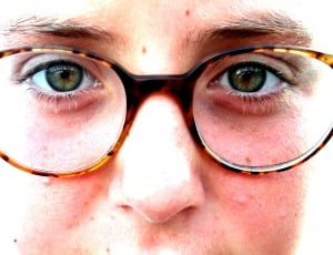 closeup photo of person face wearing eyeglasses thumbnail