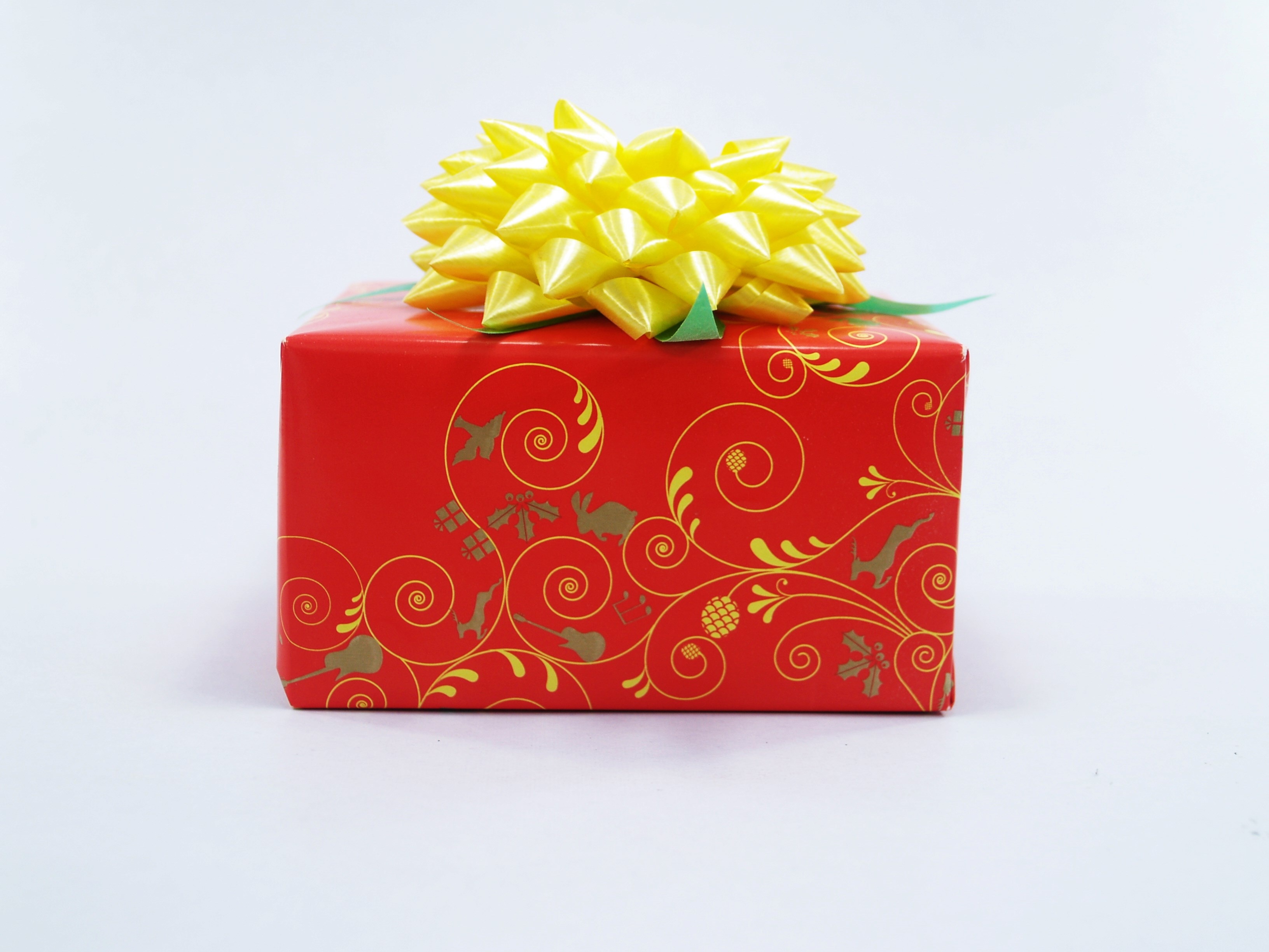 red floral gift box with yellow bow
