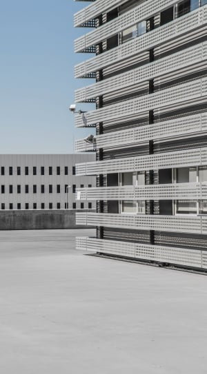 capture image of a concrete building during day time thumbnail