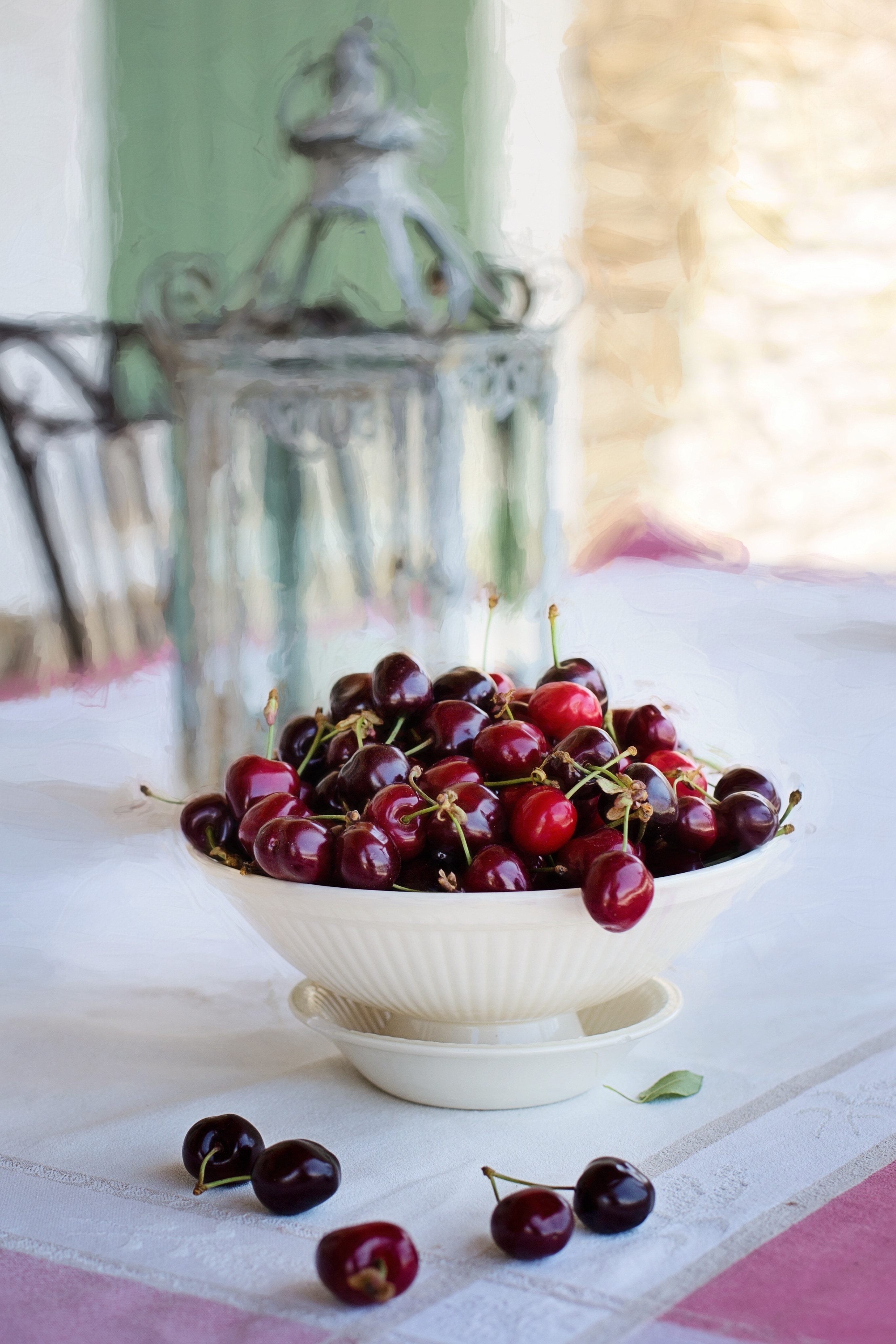 cherries in white bowl