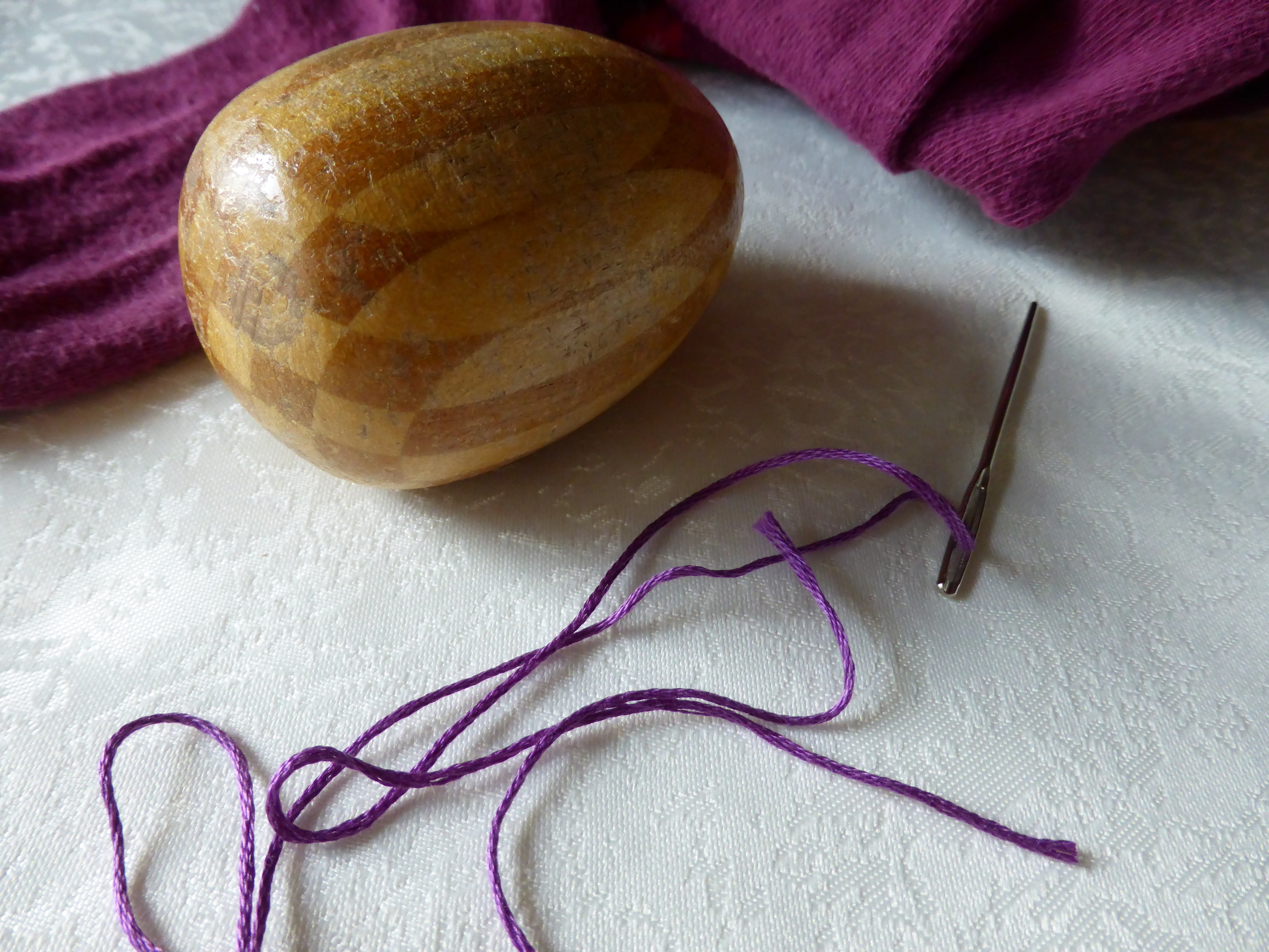 purple thread with needle