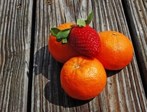 3 orange fruits and 1 strawberry thumbnail