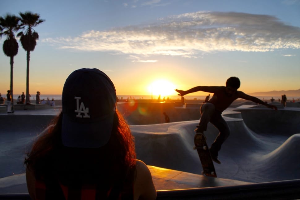 2 people playing skateboard during sunset preview