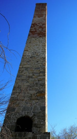 white and red concrete chimney during daytime thumbnail