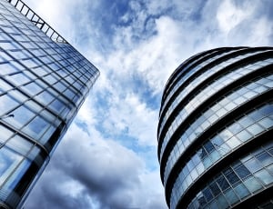 two concrete glass buildings during daytime thumbnail