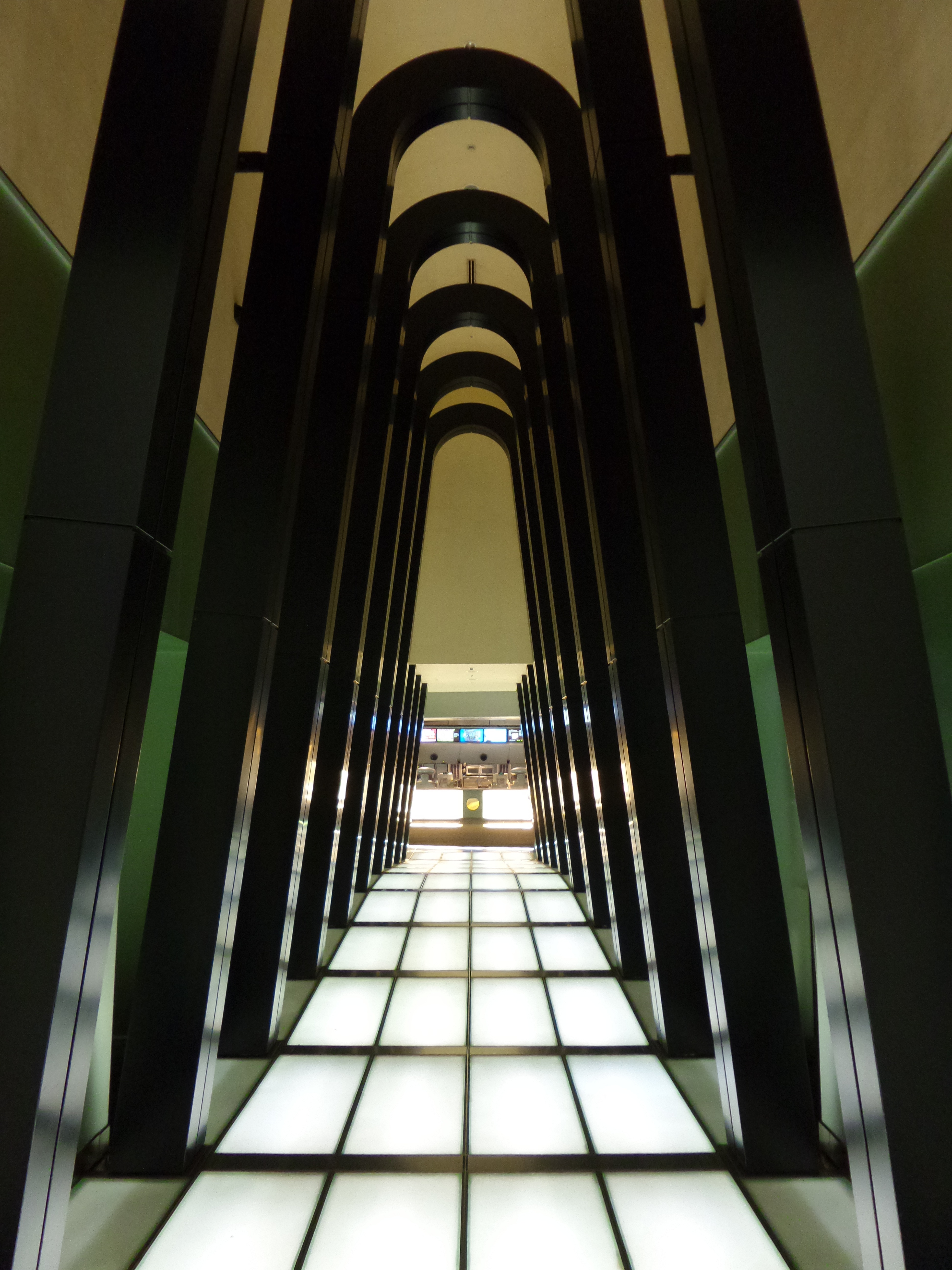 hallway with black concrete pillars