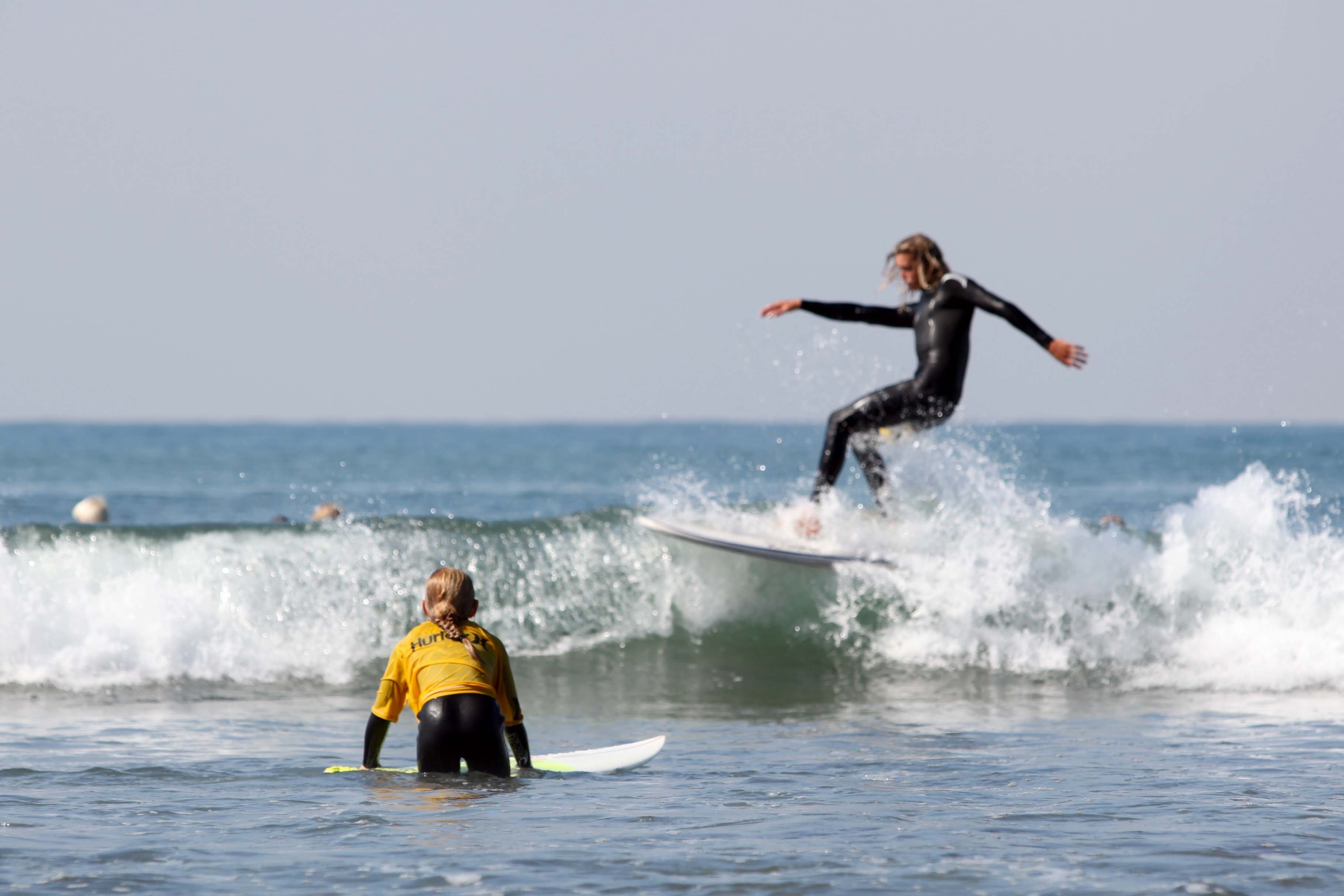 2 woman with surfing boards