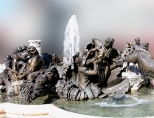 religious figurines in fountain decor thumbnail