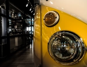yellow and white classic car inside the room thumbnail