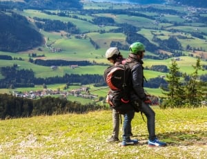 man and woman on the mountains during daytime thumbnail
