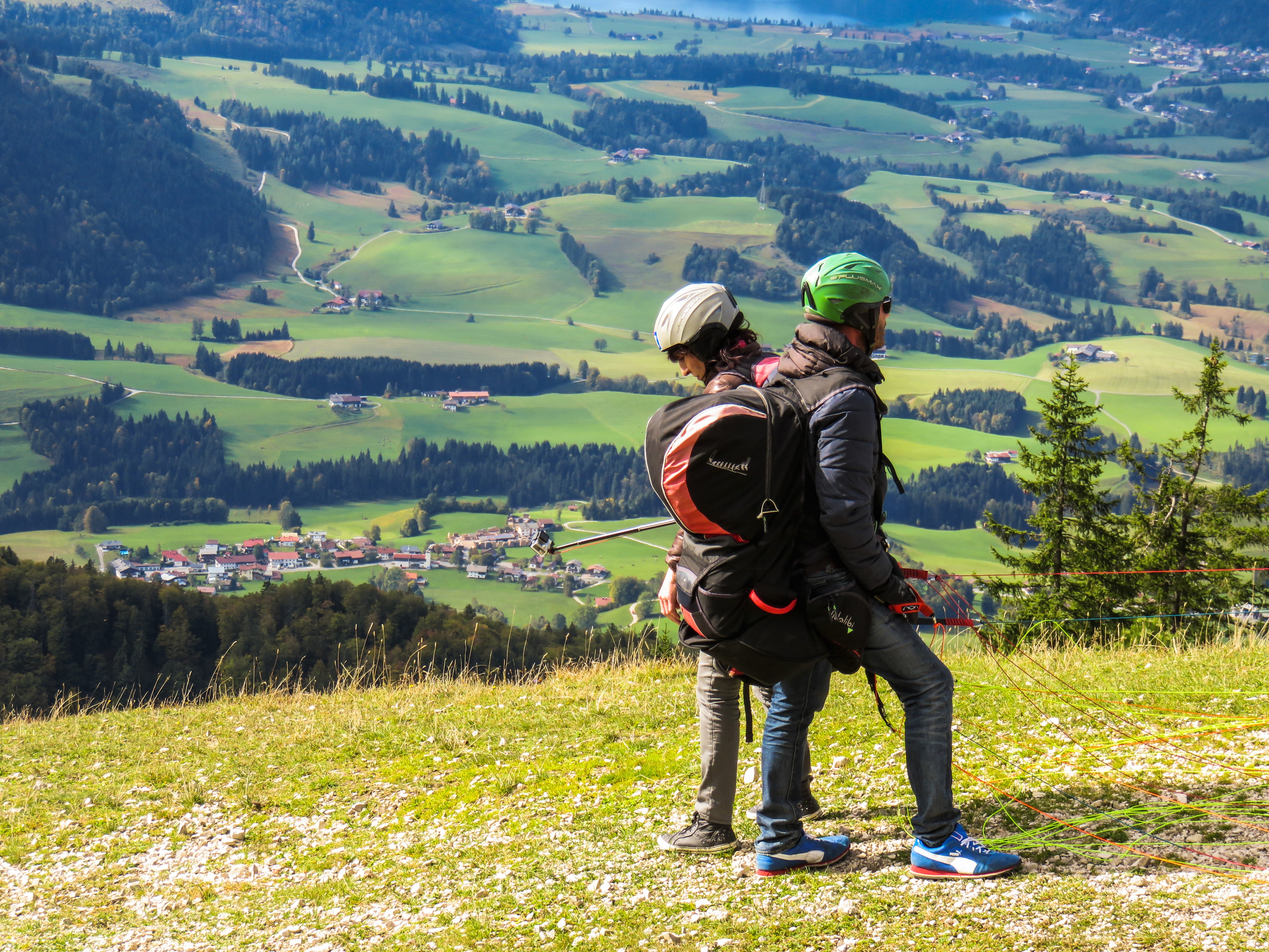 man and woman on the mountains during daytime
