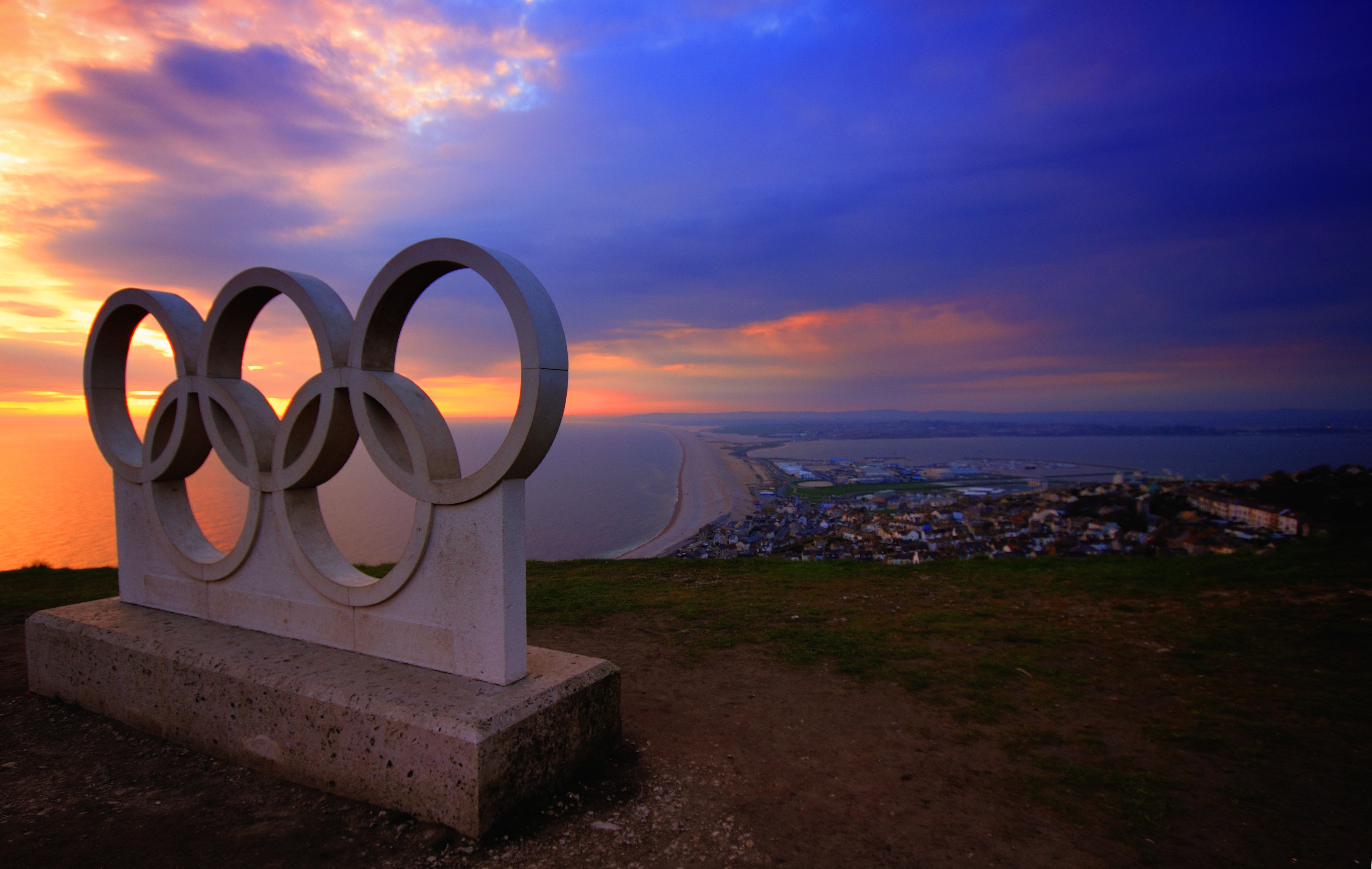 Olympics concrete logo statue on top of mountain